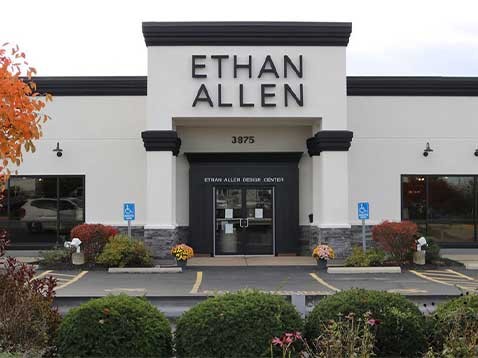 Storefront of with a large Ethan Allen logo